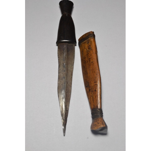 58 - Antique African dagger with a carved handle and sheath bound by fine wire approx 21.5cm high.