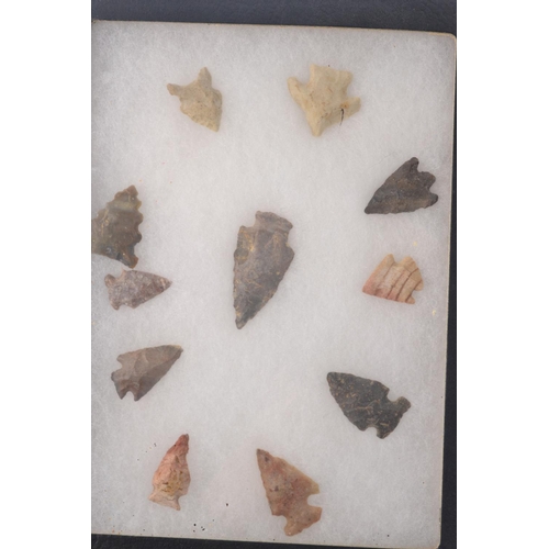 58E - A personal collection of Native American arrow heads in two small display cases