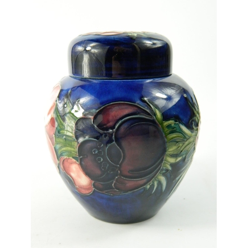 62 - Moorcroft pottery ginger jar having Anemone flower head design on a blue ground approx 12 cm high. N... 