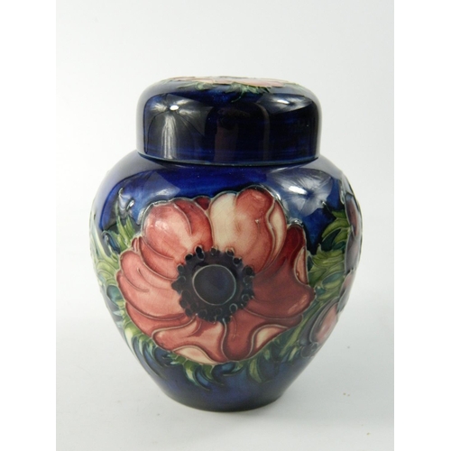 62 - Moorcroft pottery ginger jar having Anemone flower head design on a blue ground approx 12 cm high. N... 