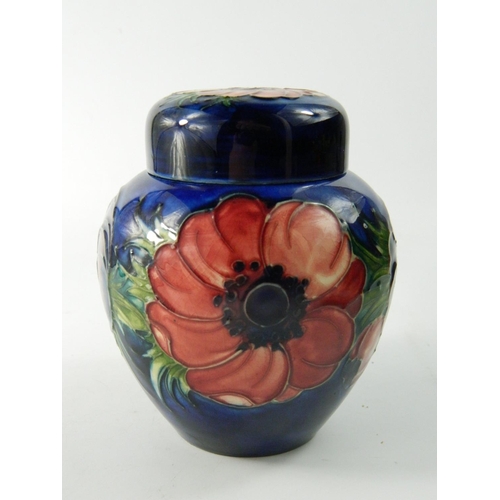 62 - Moorcroft pottery ginger jar having Anemone flower head design on a blue ground approx 12 cm high. N... 