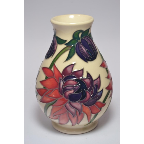 64 - Moorcroft Pottery bulbous vase having Lotus pattern on cream ground, signed base, approx 14cm high