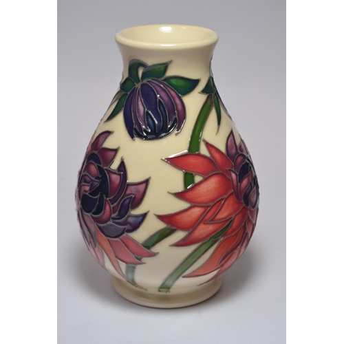 64 - Moorcroft Pottery bulbous vase having Lotus pattern on cream ground, signed base, approx 14cm high