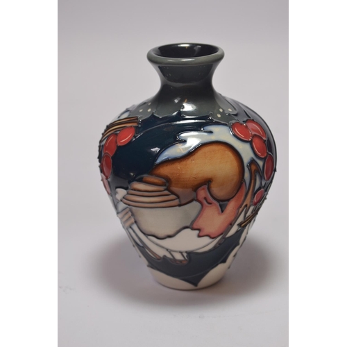 65 - Moorcroft pottery baluster vase having robin and holly design by Kerry Goodwin, approx 10cm high