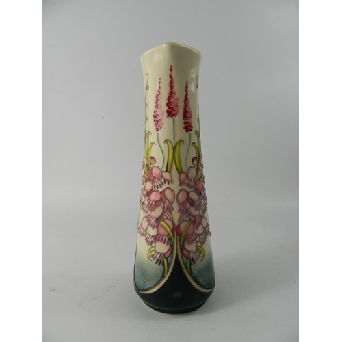 68 - Moorcroft pottery slender jug having pink floral design, trial piece, marked and dated to base - app... 