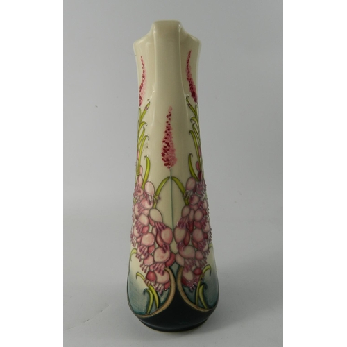 68 - Moorcroft pottery slender jug having pink floral design, trial piece, marked and dated to base - app... 