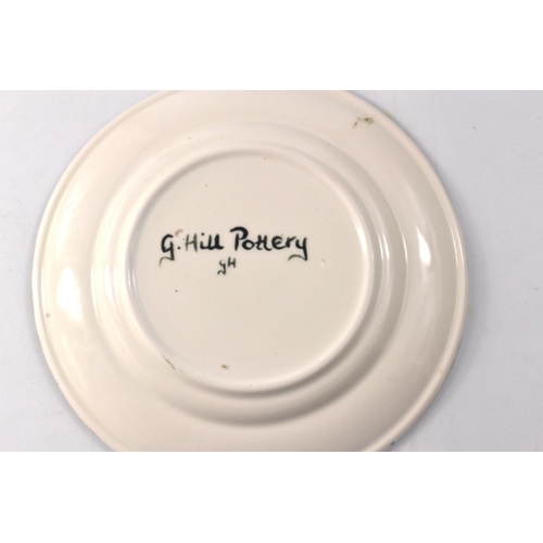 78 - Griselda Hill Wemyss pottery plate housing strawberry and leaf border decoration on a black ground -... 