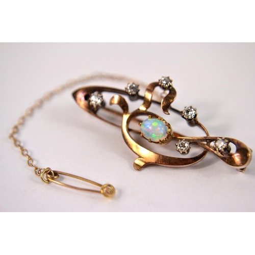 15A - Yellow metal abstract scroll design brooch claw set with 6 small diamond and oval opal (including 19... 