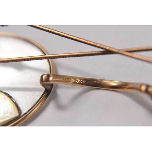 22 - Two pairs of stamped 10ct vintage spectacles and a nosebridge. Gross weight: 32g