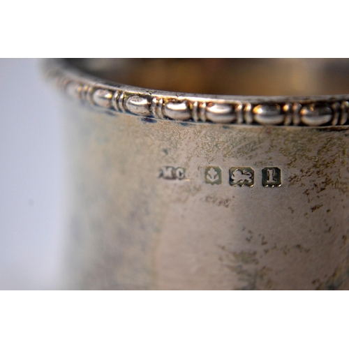 42 - 2 silver napkin rings 'Muriel and Neil' inscribed with reed edge and concave egg shape Birmingham 19... 