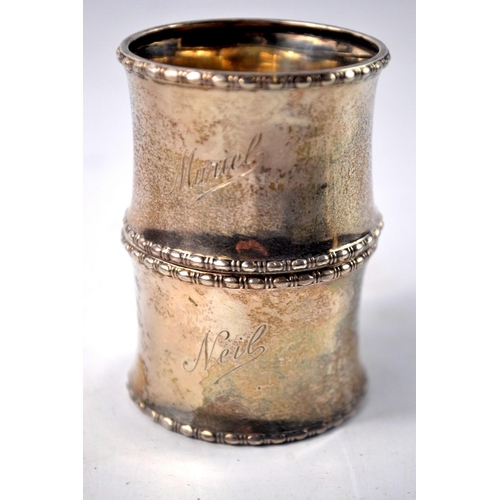 42 - 2 silver napkin rings 'Muriel and Neil' inscribed with reed edge and concave egg shape Birmingham 19... 