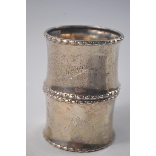 42 - 2 silver napkin rings 'Muriel and Neil' inscribed with reed edge and concave egg shape Birmingham 19... 