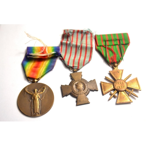 119B - Set of French medals to include WWI Victory medal, WWI Croix Du Combattant WWI Croix de Guerre