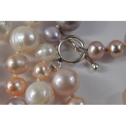 19 - Stamped 925 clasp, hand knotted string of pearls, in differing colours