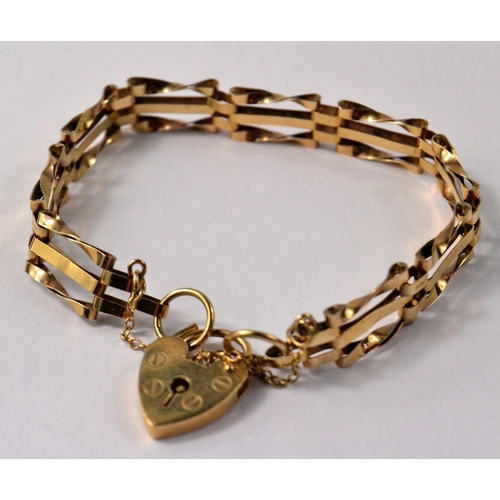 1 - 9ct gold twisted gate bar bracelet & lock.