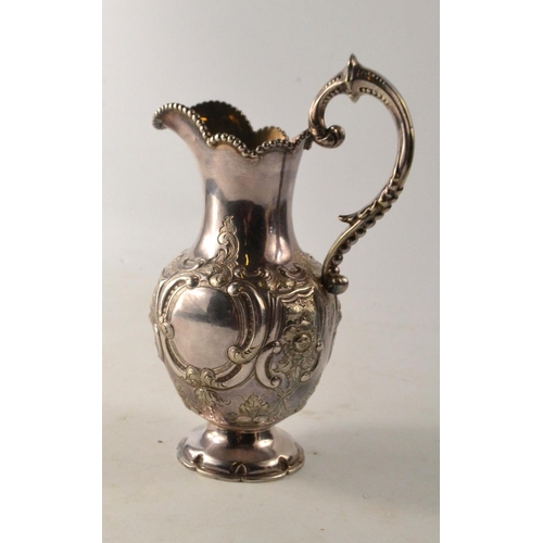 137 - 19th C Glasgow silver ewer, with scrolling and floral decoration, gilt lined interior