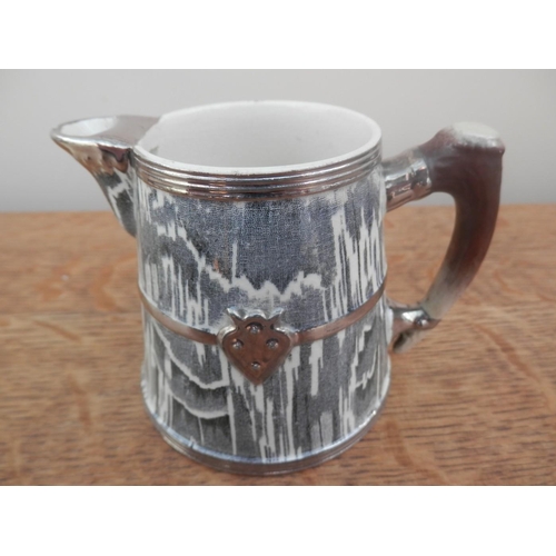 189 - An 1899 milk jug from the Capping and Wood company in the 