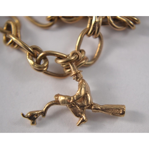 27 - 9 Carat gold charm bracelet to include 6 charms and a mounted quarter Kruggerand (POND)