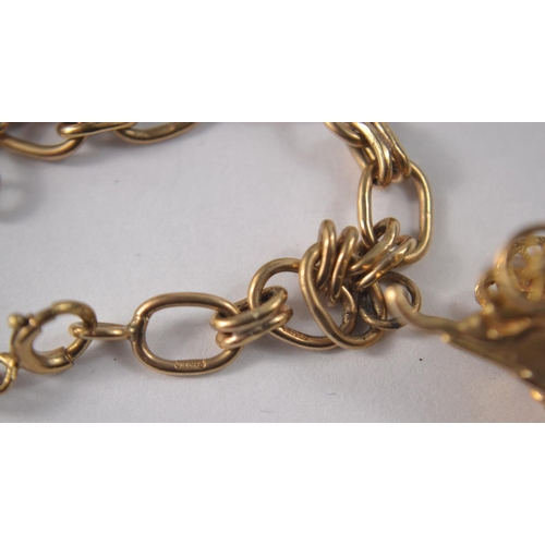 27 - 9 Carat gold charm bracelet to include 6 charms and a mounted quarter Kruggerand (POND)