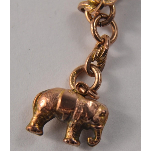 28 - A 9ct gold necklace with a yellow metal` elephant charm pendant