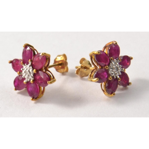 45 - Pair of 9k yellow gold stud ruby earrings with diamond setting