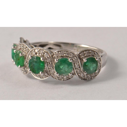 46 - STUNNING 18ct white gold emerald and diamond ladies ring. Size O