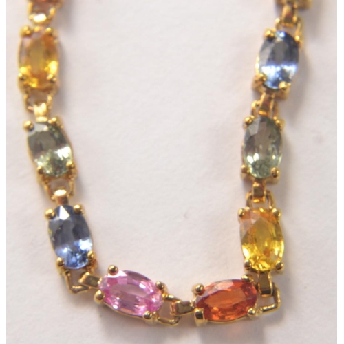 49 - STUNNING 375 yellow gold marked bracelet with multi coloured sapphire  stones. Comes with authentici... 