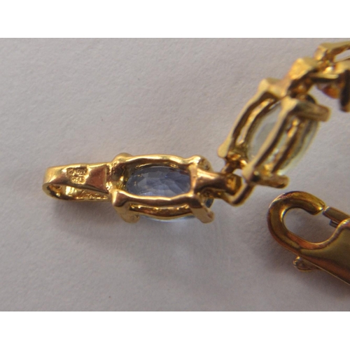 49 - STUNNING 375 yellow gold marked bracelet with multi coloured sapphire  stones. Comes with authentici... 