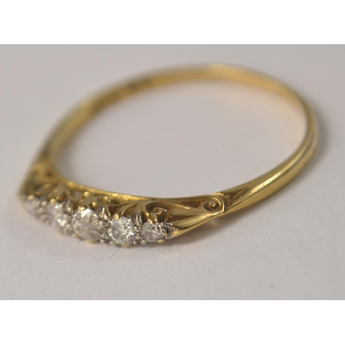 59 - Edwardian 18ct gold 5 diamond stone set ring with scrolling setting. Size W/X