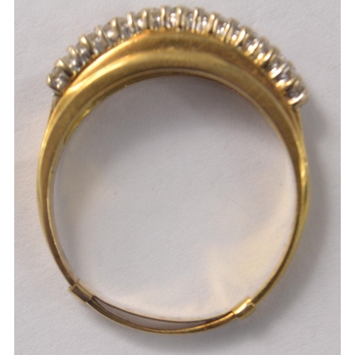 20 - 18ct gold 9 diamond set ring in a raised setting. With 9ct sizer insert (Size T/U)