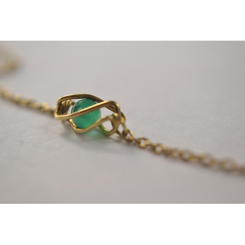 56 - 9ct gold necklace set with 5 jade bead