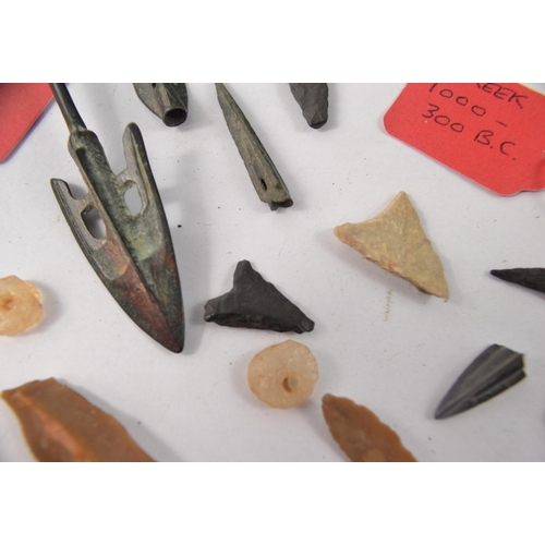 78 - Selection of metal and stone arrowheads, possibly African. Some with information tags of Greek origi... 