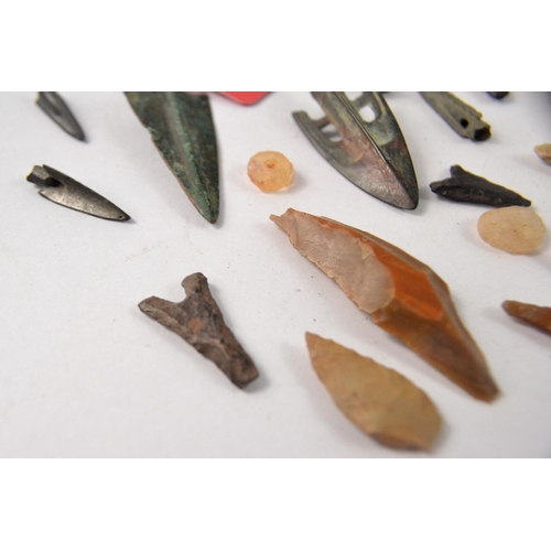 78 - Selection of metal and stone arrowheads, possibly African. Some with information tags of Greek origi... 