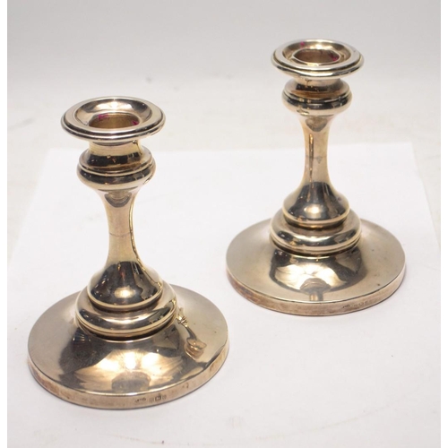 136 - Quantity of silver candlesticks Birmingham Hallmark 1915 light-wooden bases 373g gross  (H: 11cm) an... 