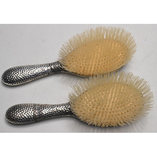 139 - Pair of vintaqe silver Birmingham Hallmark backed brushes