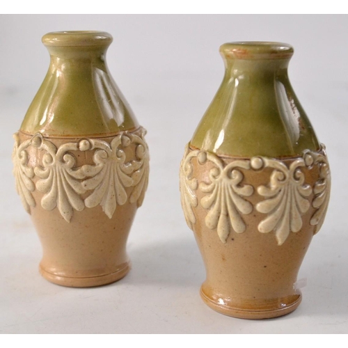 171 - Mauchline ware money bank of barrel shape and a miniature pair of Doulton Lambeth vases