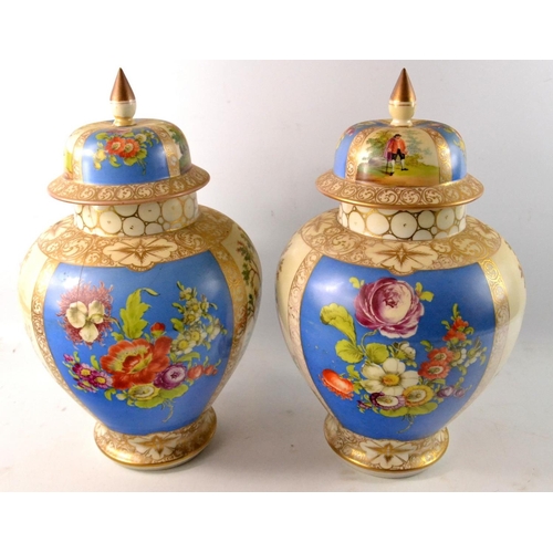 173 - Pair of Victorian scene temple jars and covers with beige and blue ground and gilt highlight. With f... 