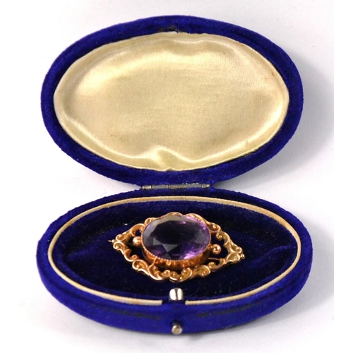 19 - Stunning vintage oval shaped amethyst set in 9ct scrolled brooch