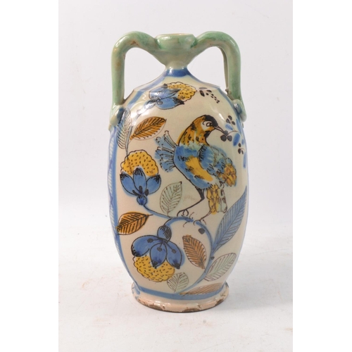 191 - Faience twin handled vase, hand painted with birds.