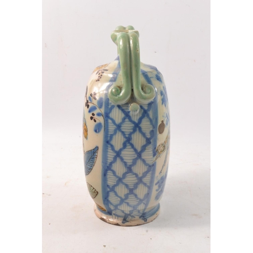 191 - Faience twin handled vase, hand painted with birds.