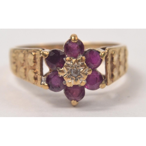 61 - 9ct Amethyst and diamond floral set ring, with hearts on the shoulders. Size M