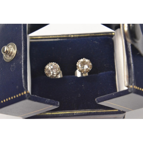 66 - STUNNING ! Pair of round brilliant solitaire diamond studs, total weight of diamonds approx 1.60ct, ... 