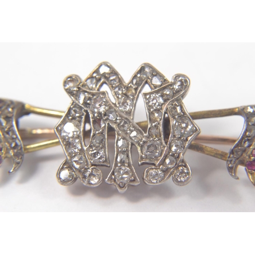 71 - Yellow and White metal crossed spears with the initials M,N depicted in old cut diamonds in centre, ... 