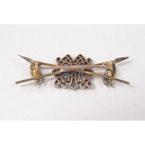 71 - Yellow and White metal crossed spears with the initials M,N depicted in old cut diamonds in centre, ... 