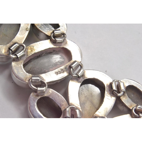 73 - QUALITY Heavy Silver T-Bar fastening bracelet, set with oval and teardrop shaped smokey grey stones ... 