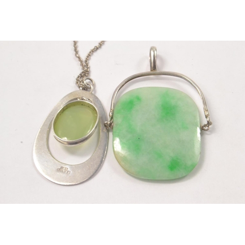 75 - Silver pendant set with green stone on a silver chain [L:50cm] and another Jadeite style swivel pend... 