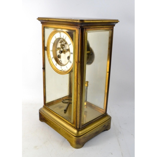 82 - A c1900's French large brass 4 sided glass clock with enameled numeral face. With mercury filled pen... 