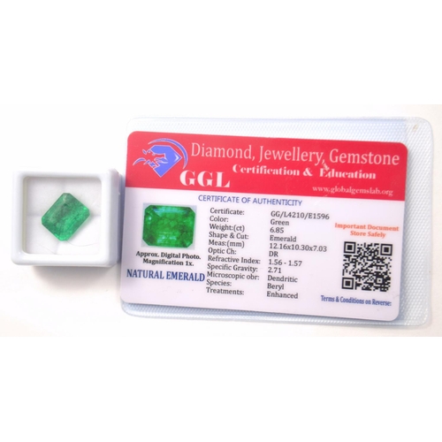 15 - Green 6.85ct emerald cut enhanced NATURAL EMERALD with certificate