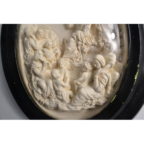 207 - Late c19th century oval glass framed carved biblical scene