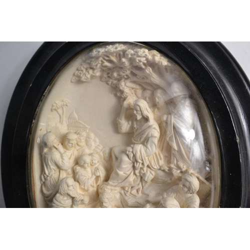 207 - Late c19th century oval glass framed carved biblical scene